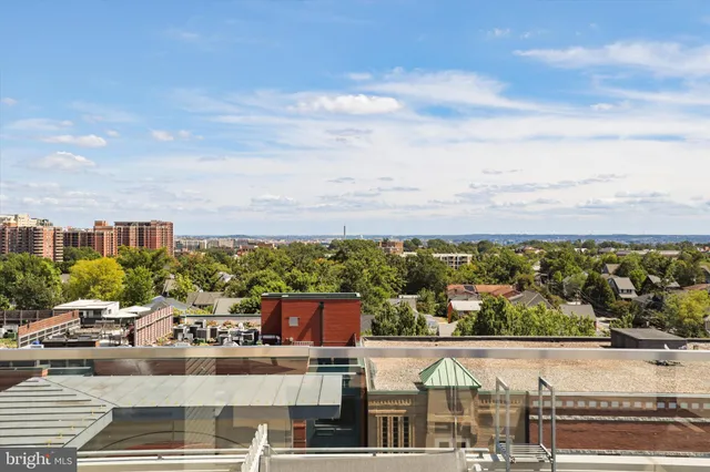 a view of a hallway with wooden walls