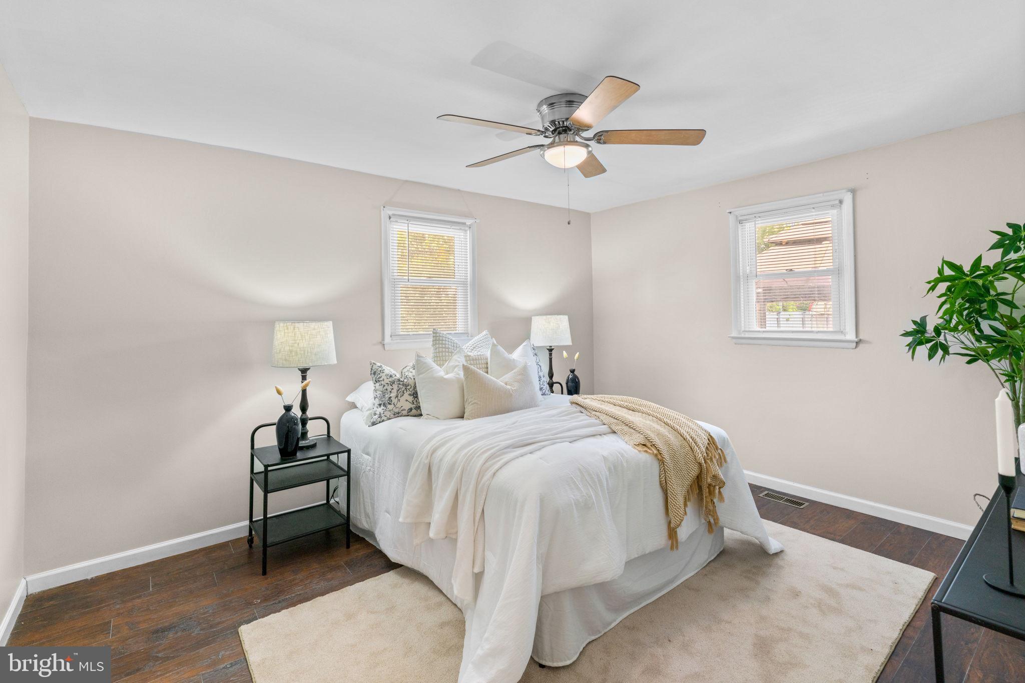 1221 Berkwood Road Baltimore, MD 21237 - Photo 14 of 34 a bedroom with a bed and a chandelier