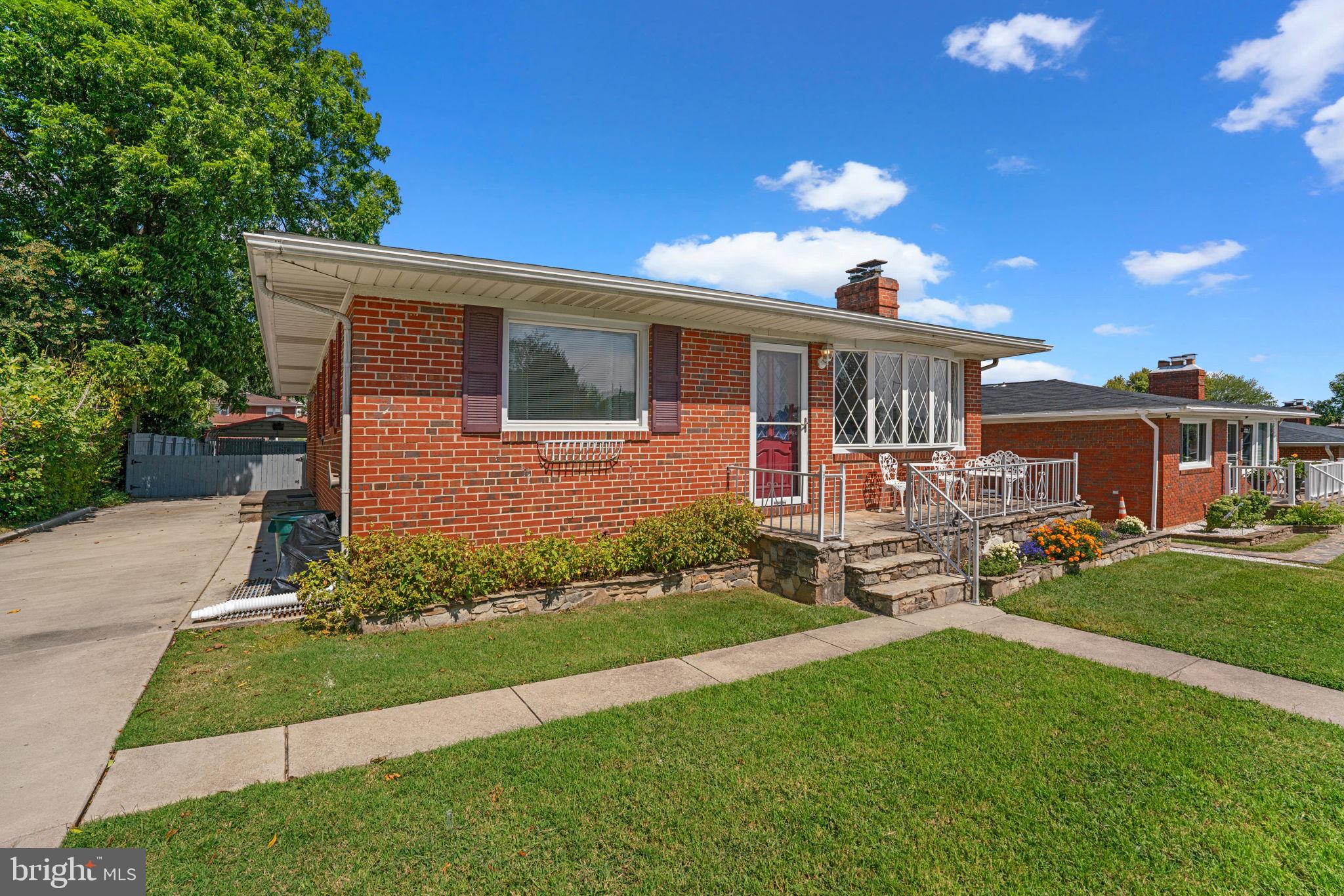 1221 Berkwood Road Baltimore, MD 21237 - Photo 2 of 34 a front view of a house with a yard