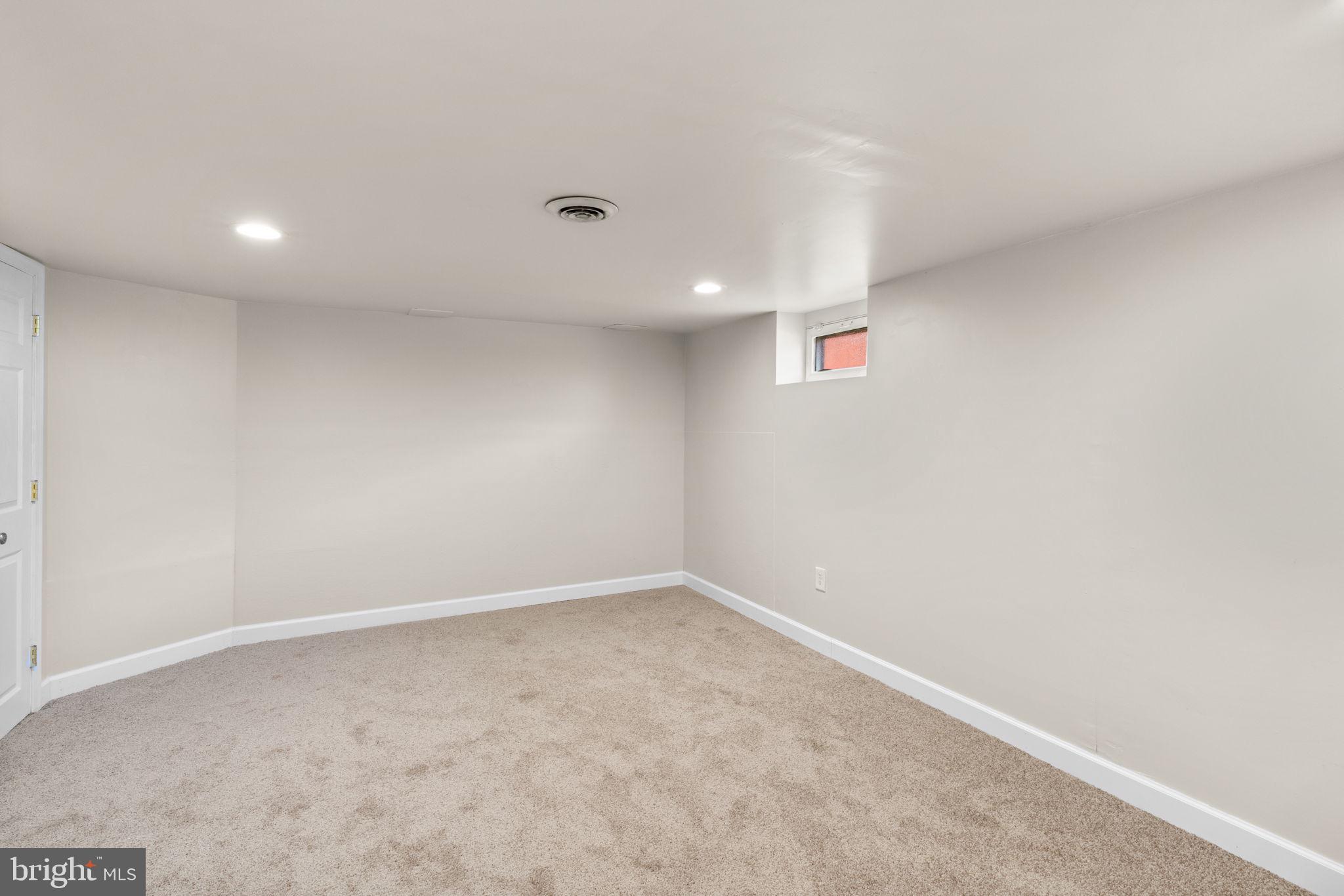 1221 Berkwood Road Baltimore, MD 21237 - Photo 21 of 34 an empty room with a workbench