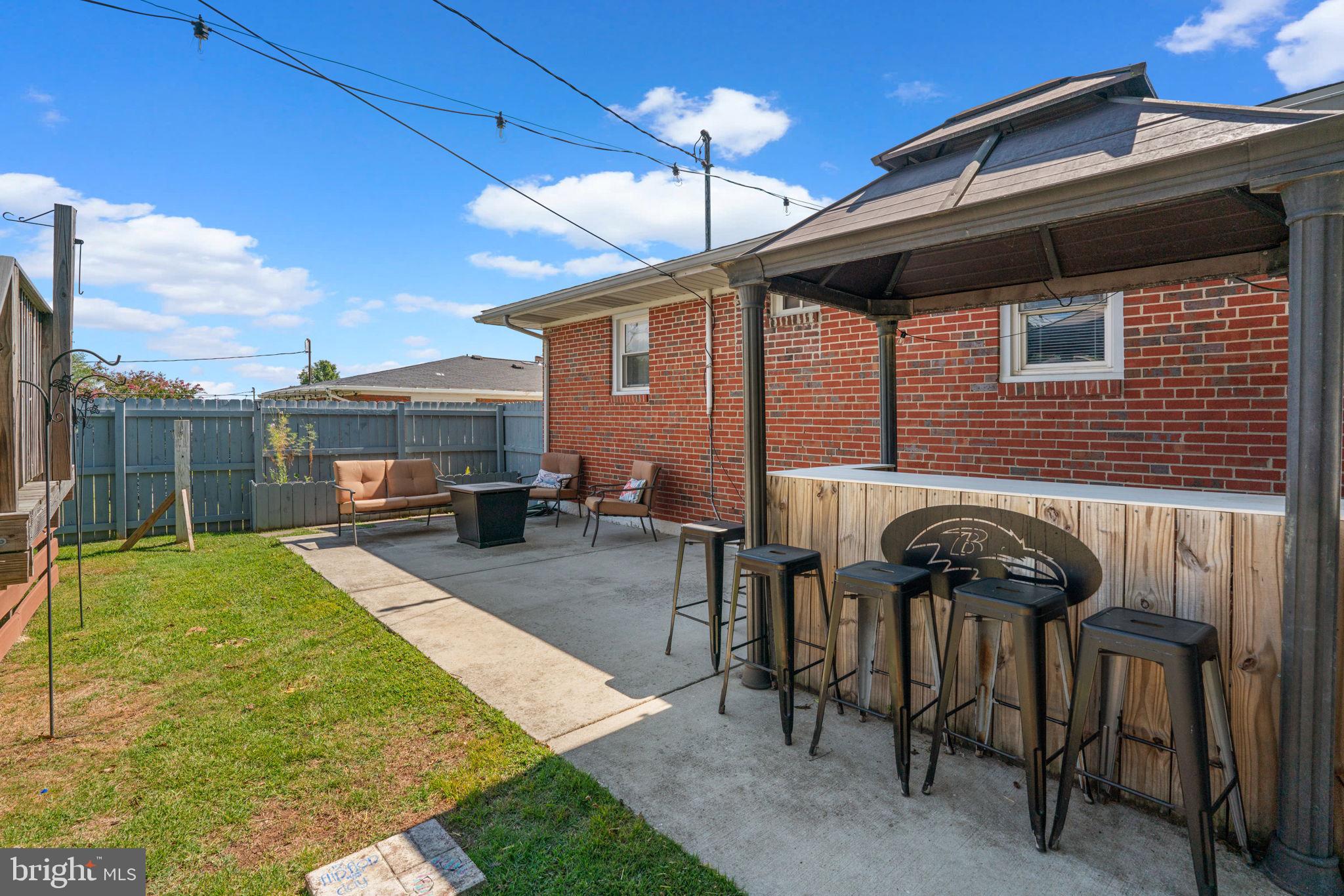 1221 Berkwood Road Baltimore, MD 21237 - Photo 30 of 34 a backyard of a house with seating space