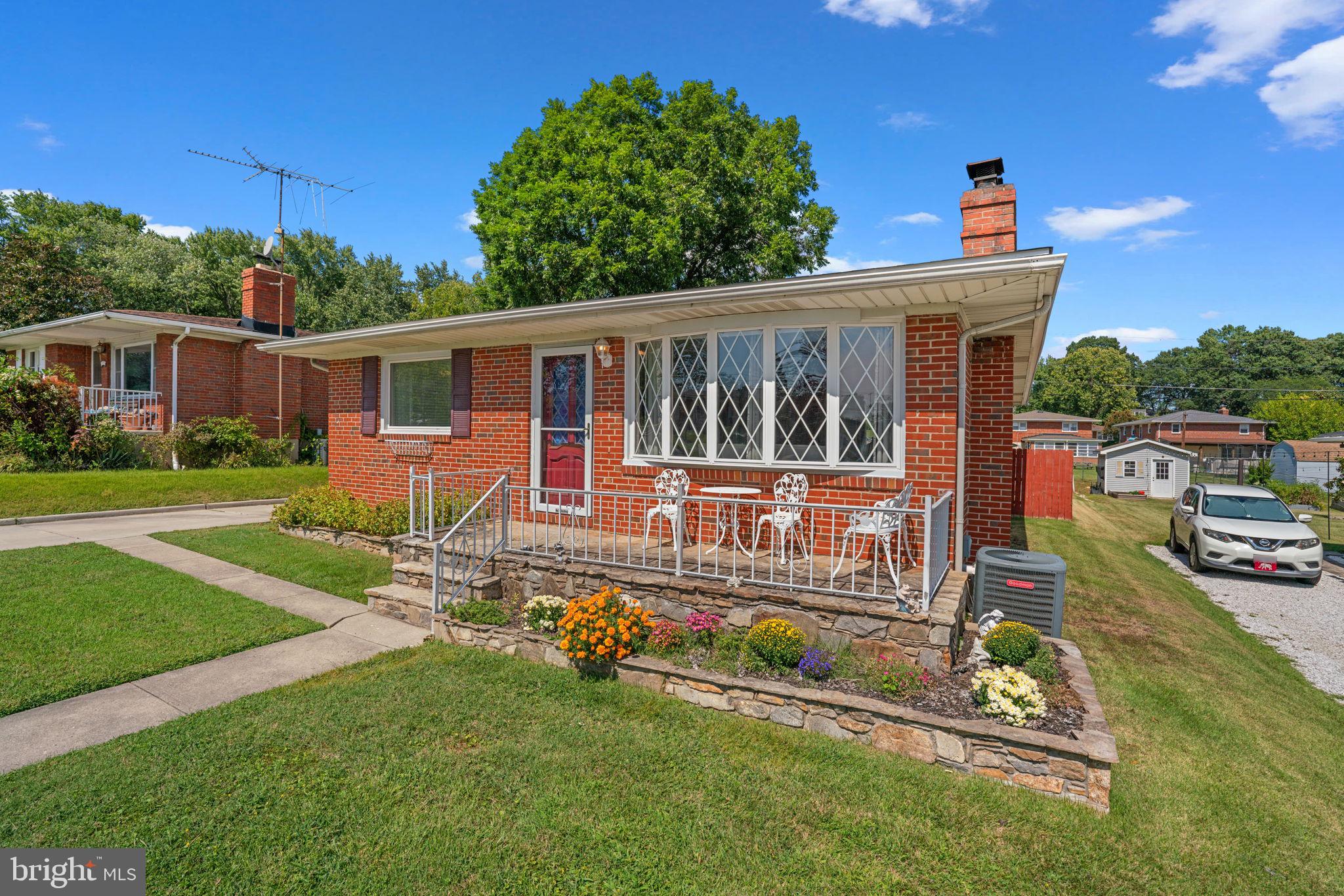 1221 Berkwood Road Baltimore, MD 21237 - Photo 3 of 34 front view of house with a yard