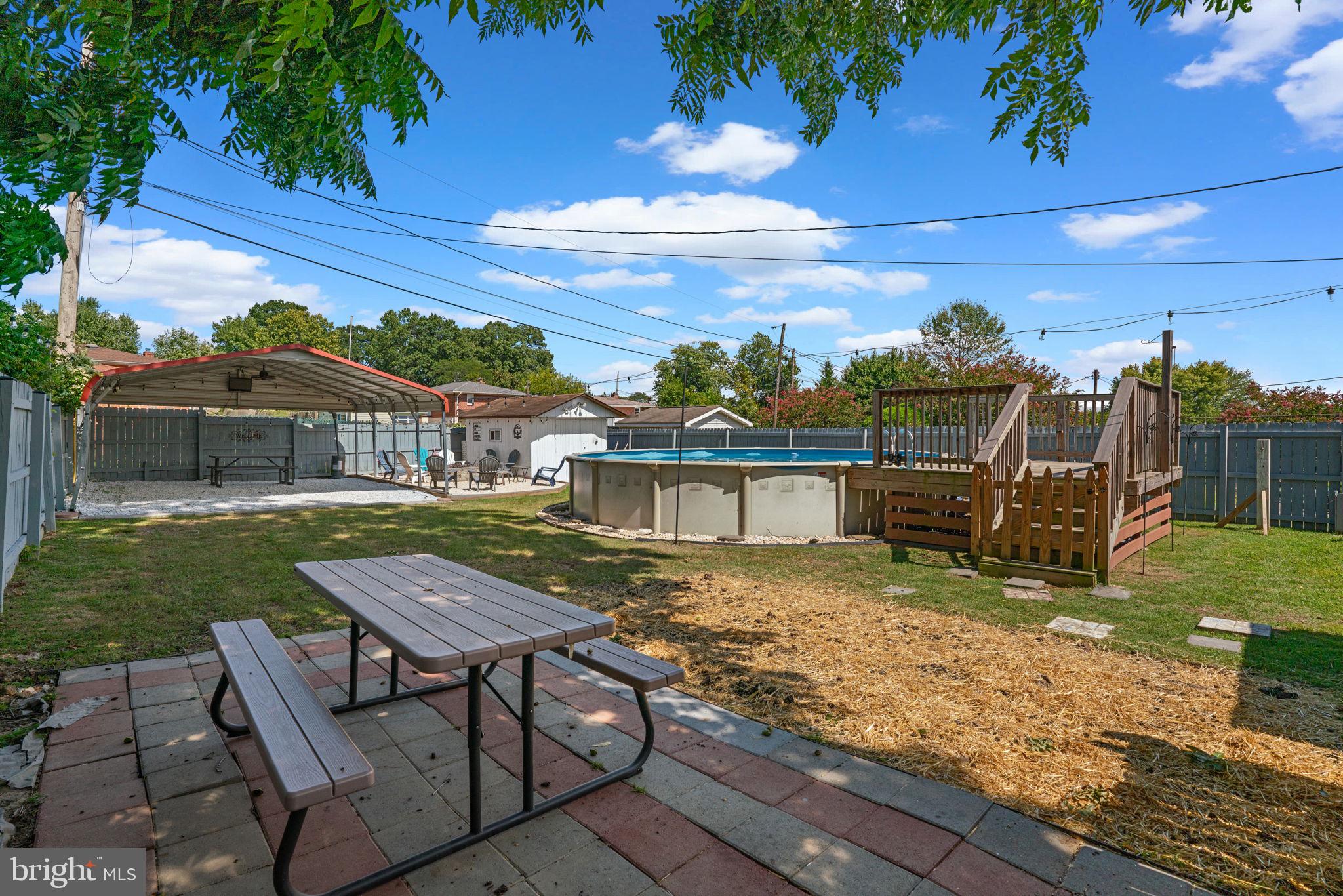 1221 Berkwood Road Baltimore, MD 21237 - Photo 31 of 34 a view of a house with backyard porch and sitting area