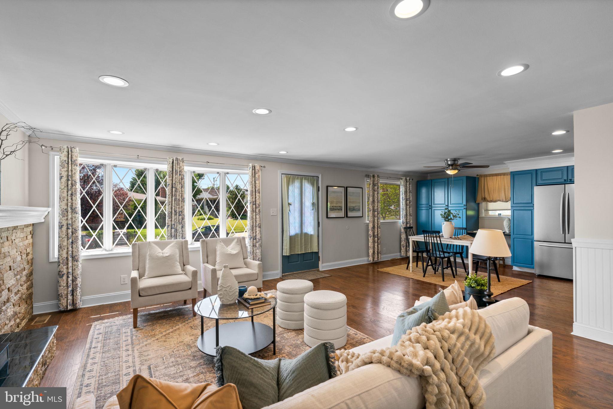 1221 Berkwood Road Baltimore, MD 21237 - Photo 6 of 34 a living room with furniture and large windows