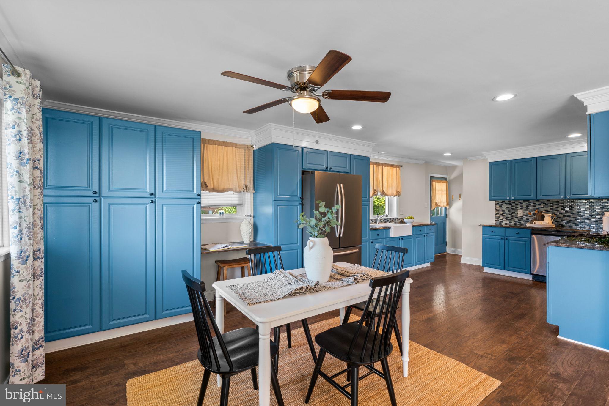 1221 Berkwood Road Baltimore, MD 21237 - Photo 7 of 34 a view of a dining room with furniture window and wooden floor