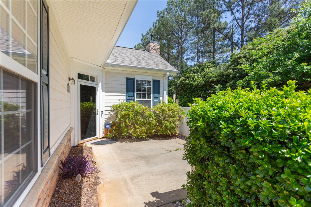 155 Life Style Lane Anderson, SC 29621 - Photo 36 of 49 This inviting exterior features lush landscaping, providing a serene outdoor retreat.