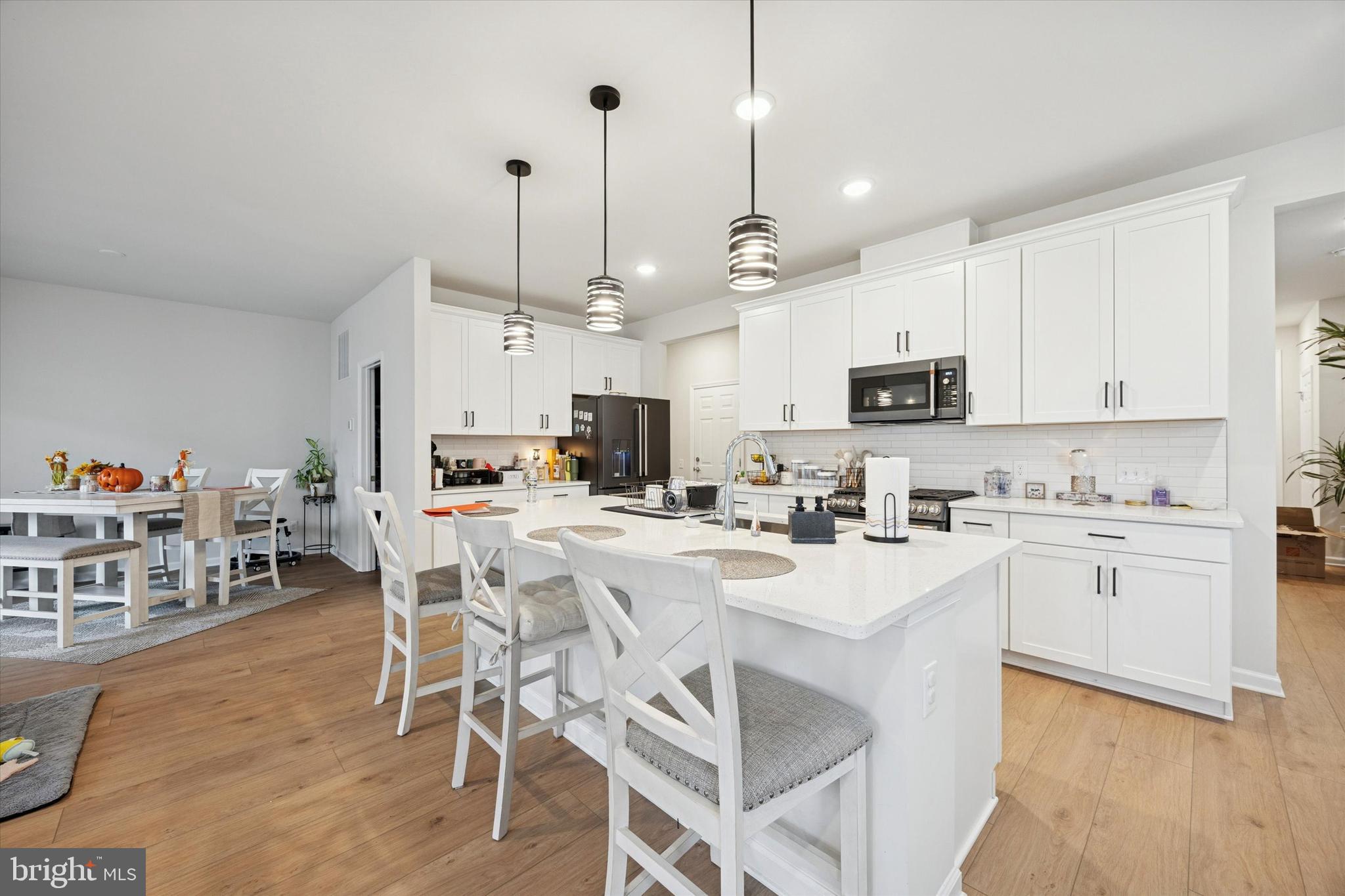 623 Liberty Ridge Road Horsham, PA 19044 - Photo 3 of 30 a kitchen with stainless steel appliances kitchen island granite countertop a sink a stove a refrigerator cabinets and chairs