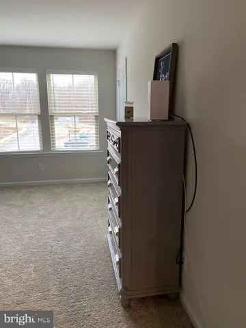 a view of storage and utility room with windows