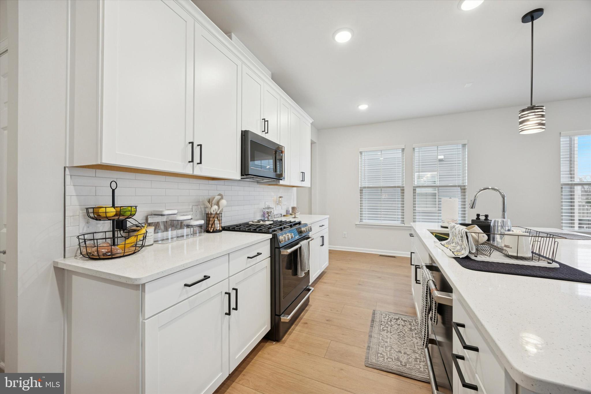 623 Liberty Ridge Road Horsham, PA 19044 - Photo 4 of 30 a kitchen with a sink stove and cabinets