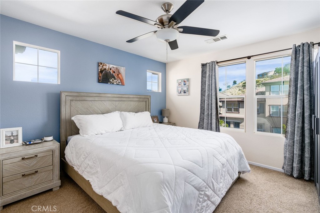 1113 Calabria Street Santee, CA 92071 - Photo 14 of 35 a bedroom with a bed and a large window