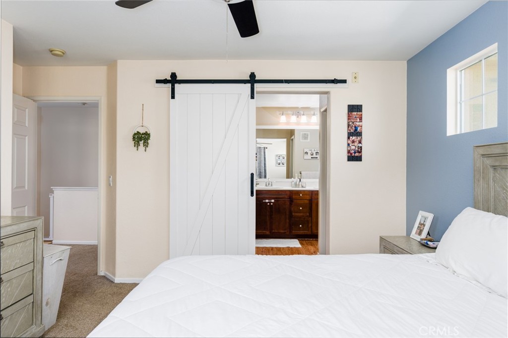 1113 Calabria Street Santee, CA 92071 - Photo 17 of 35 a bedroom with a bed and a walk in closet