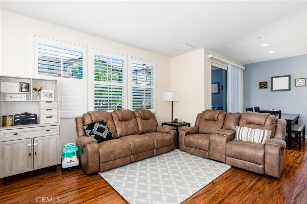 1113 Calabria Street Santee, CA 92071 - Photo 2 of 35 a living room with furniture and a wooden floor
