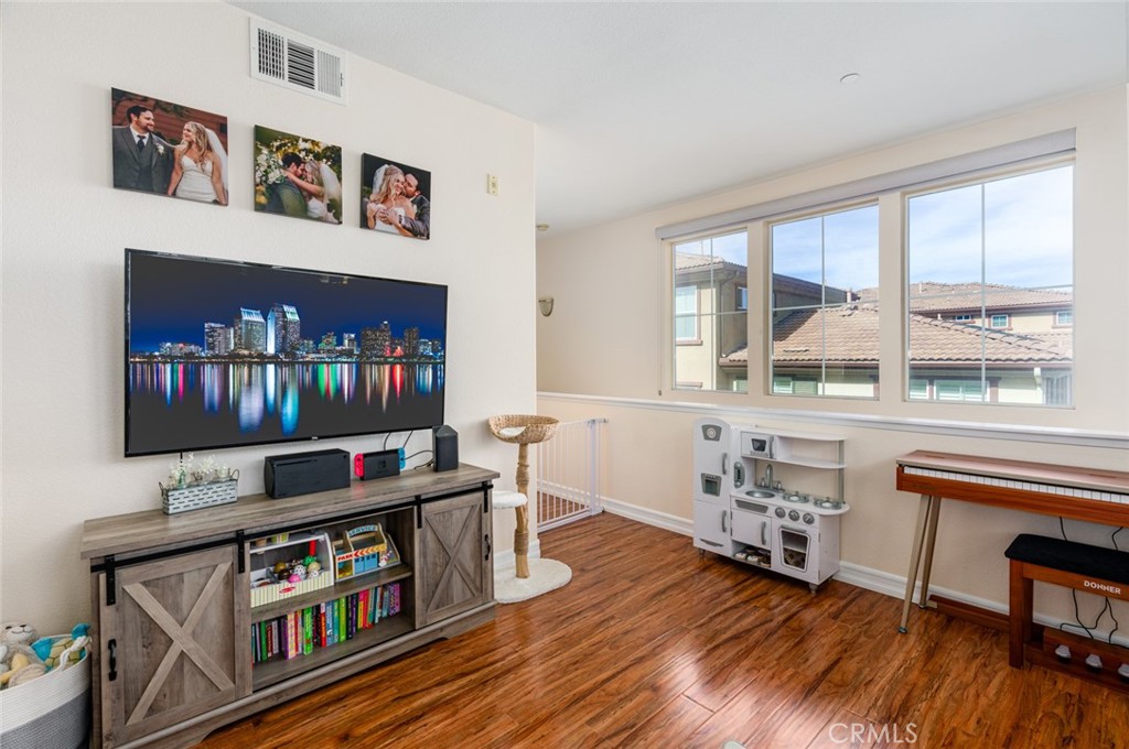 1113 Calabria Street Santee, CA 92071 - Photo 5 of 35 a living room with furniture and a flat screen tv