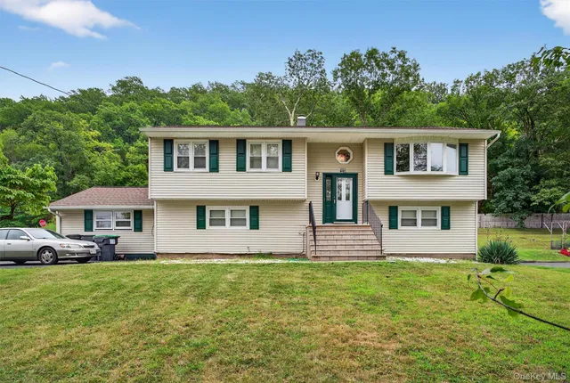 a front view of a house with a yard