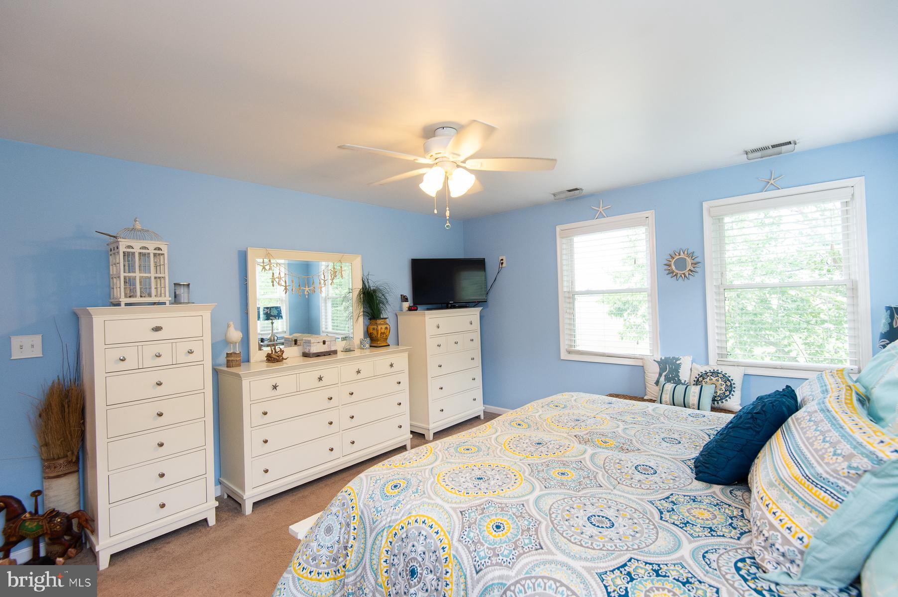 12136 Holly Road Ridgely, MD 21660 - Photo 31 of 136 a bedroom with a bed and a dresser