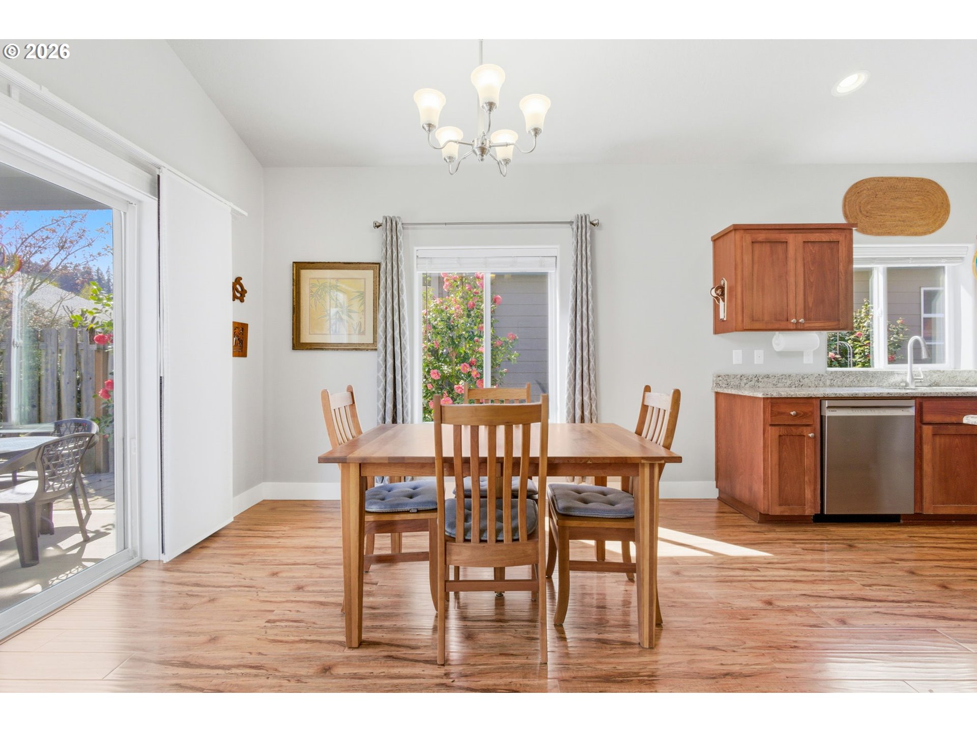 2418 Equestrian Loop South Salem, OR 97302 - Photo 11 of 39 a view of a dining room with furniture and chandelier