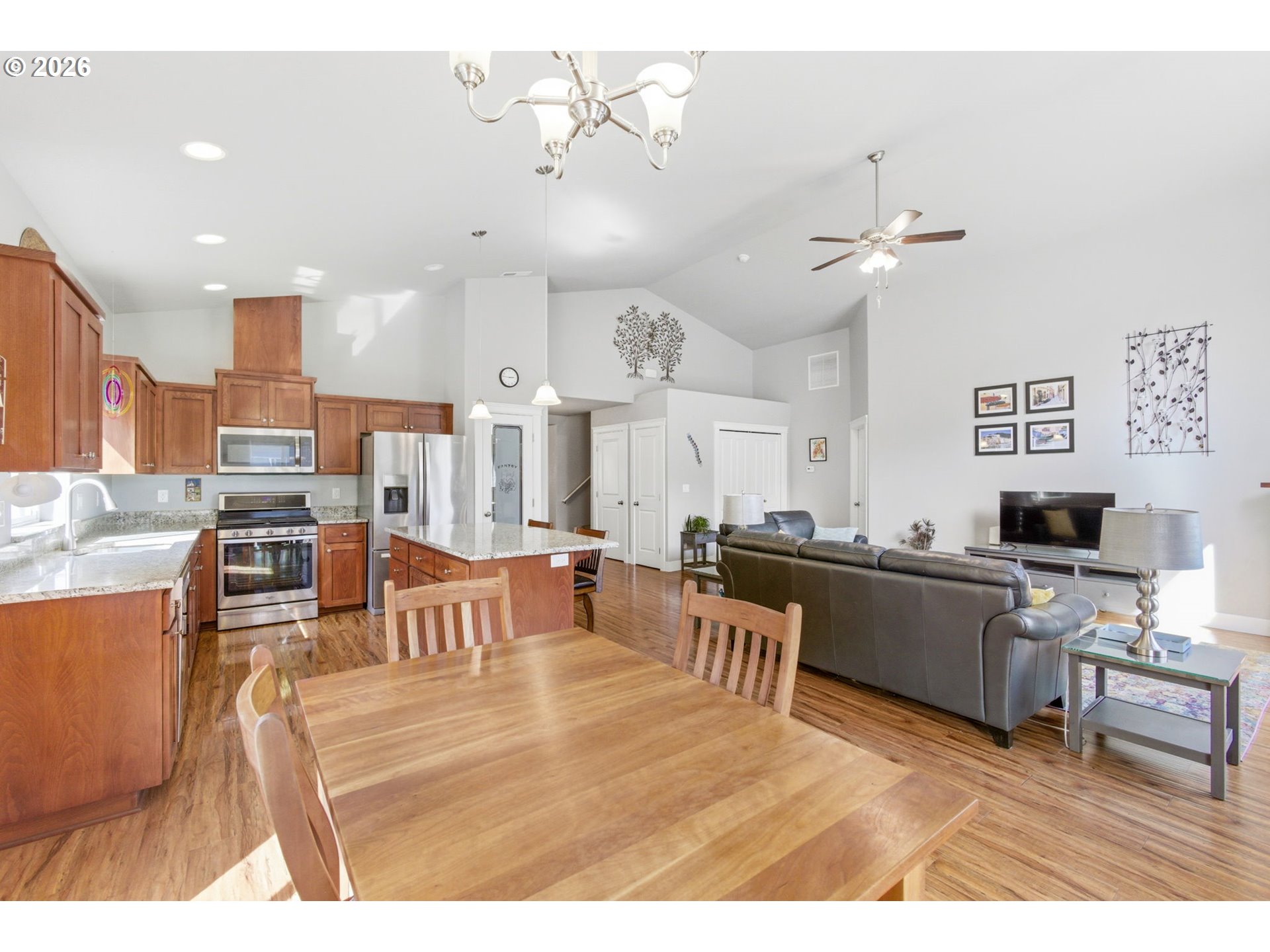 2418 Equestrian Loop South Salem, OR 97302 - Photo 12 of 39 a living room with lots of furniture and a kitchen view