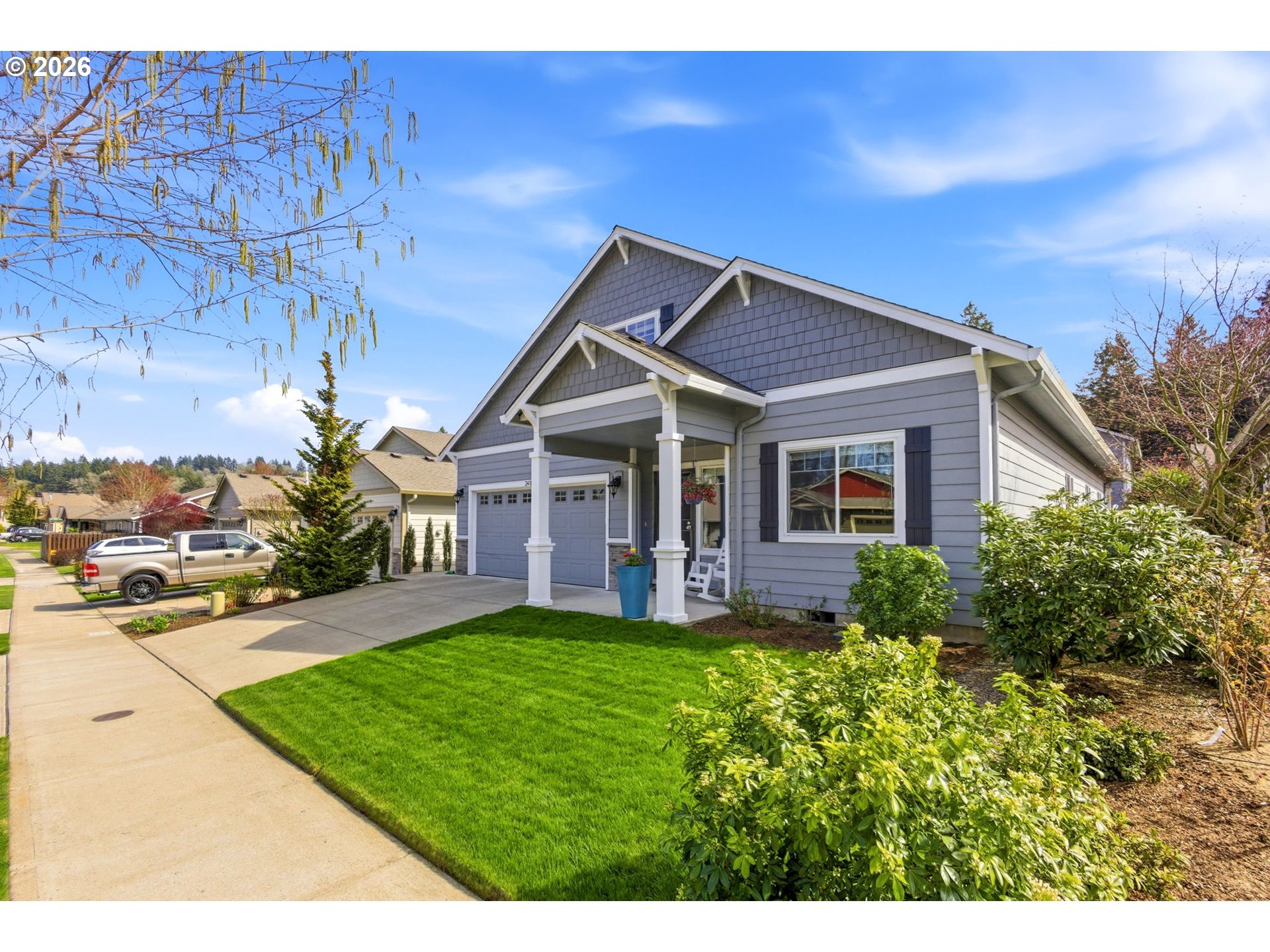 2418 Equestrian Loop South Salem, OR 97302 - Photo 2 of 39 a front view of a house with a yard and porch