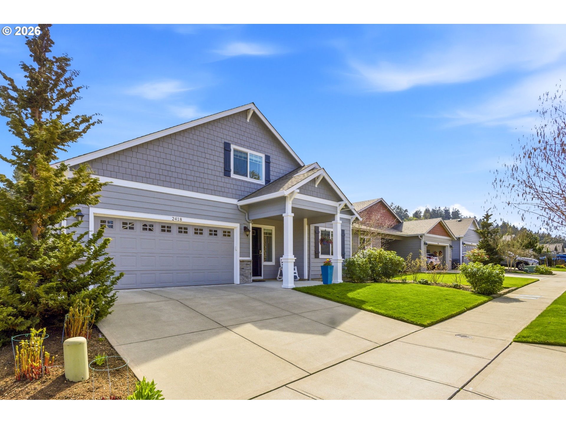 2418 Equestrian Loop South Salem, OR 97302 - Photo 3 of 39 a view of a house with a yard and potted plants