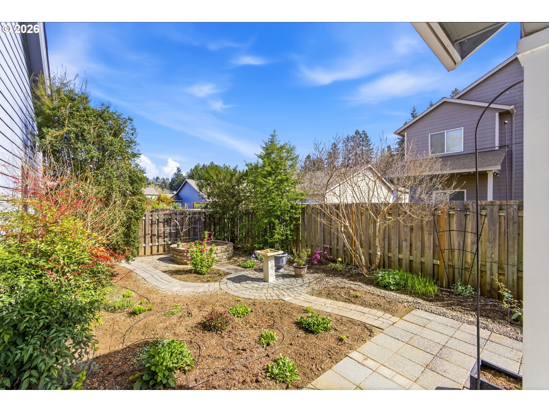 2418 Equestrian Loop South Salem, OR 97302 - Photo 37 of 39 a backyard of a house with table and chairs