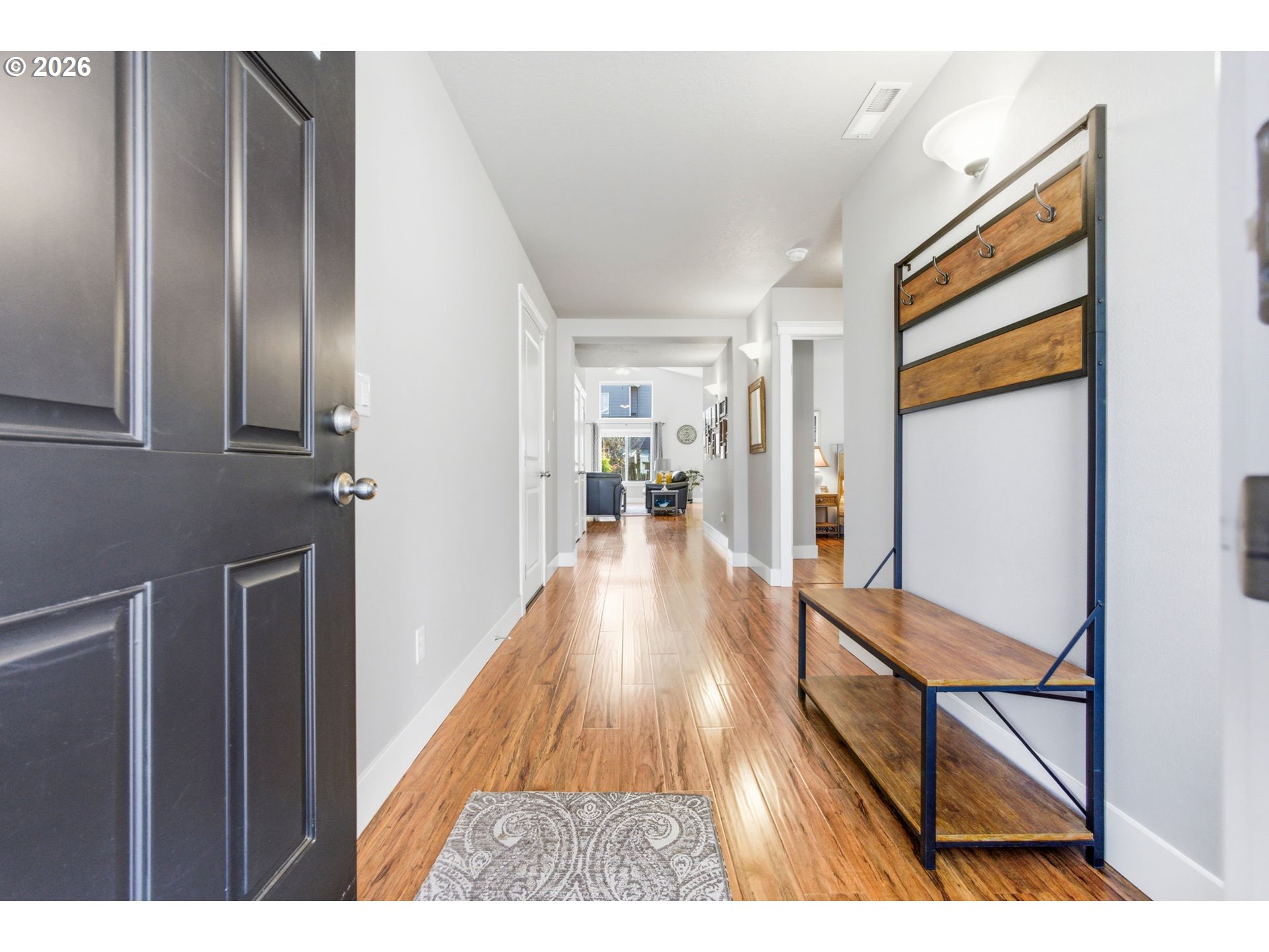2418 Equestrian Loop South Salem, OR 97302 - Photo 5 of 39 a view of a hallway view with wooden floor and furniture