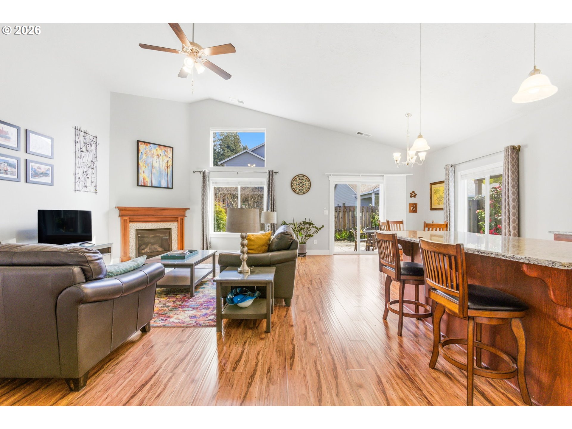 2418 Equestrian Loop South Salem, OR 97302 - Photo 7 of 39 a living room with furniture a fireplace and a flat screen tv