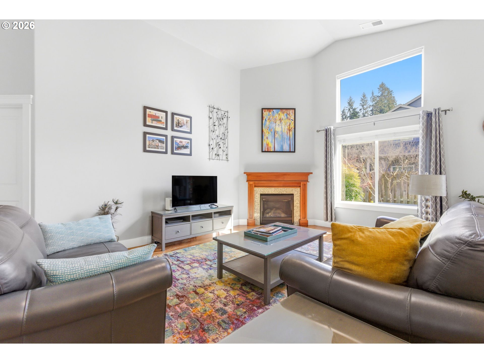 2418 Equestrian Loop South Salem, OR 97302 - Photo 8 of 39 a living room with furniture a flat screen tv and a fireplace