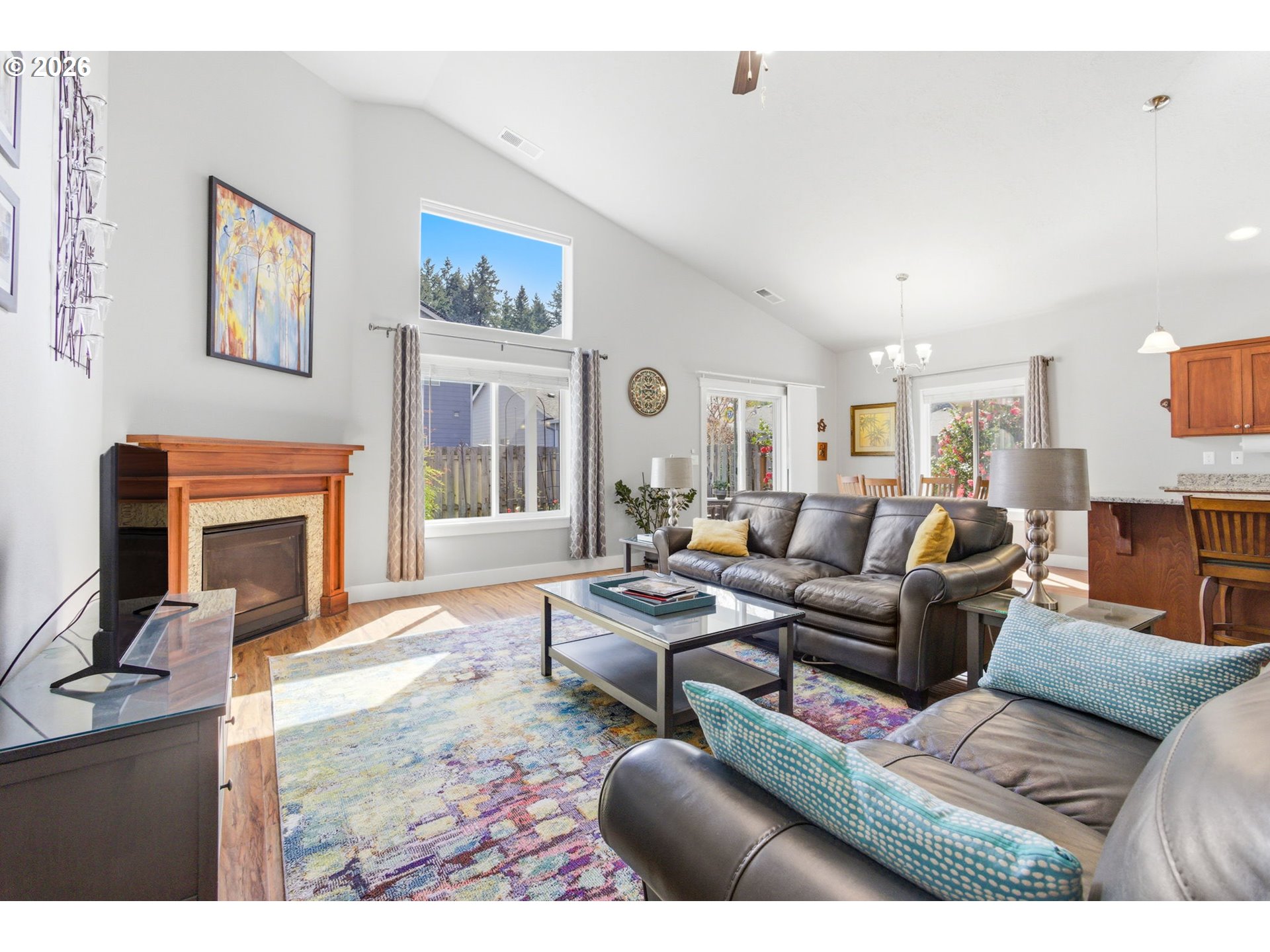 2418 Equestrian Loop South Salem, OR 97302 - Photo 9 of 39 a living room with furniture a fireplace and a flat screen tv