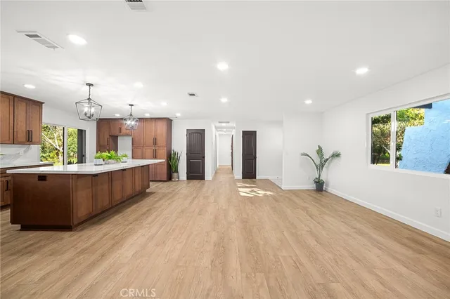a view of hallway with wooden floor