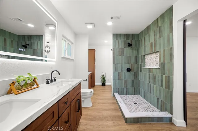 a bath tub sitting in a bathroom next to a window