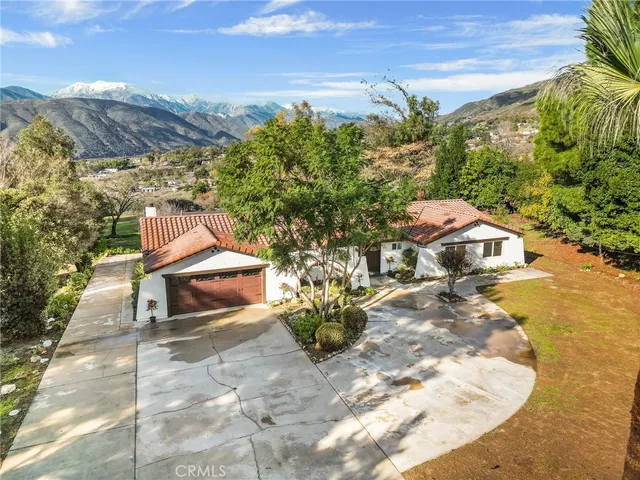 a view of a city with mountains in the background
