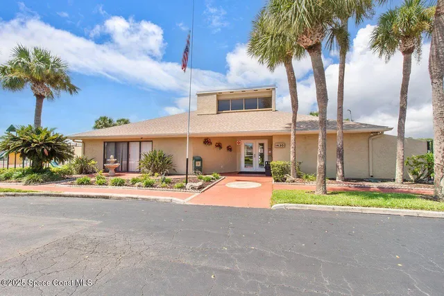 a house with trees in front of it