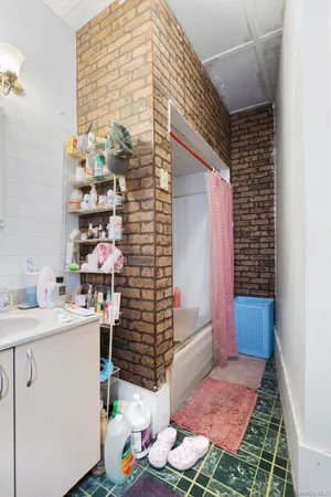 a kitchen with stainless steel appliances a sink a stove and a window