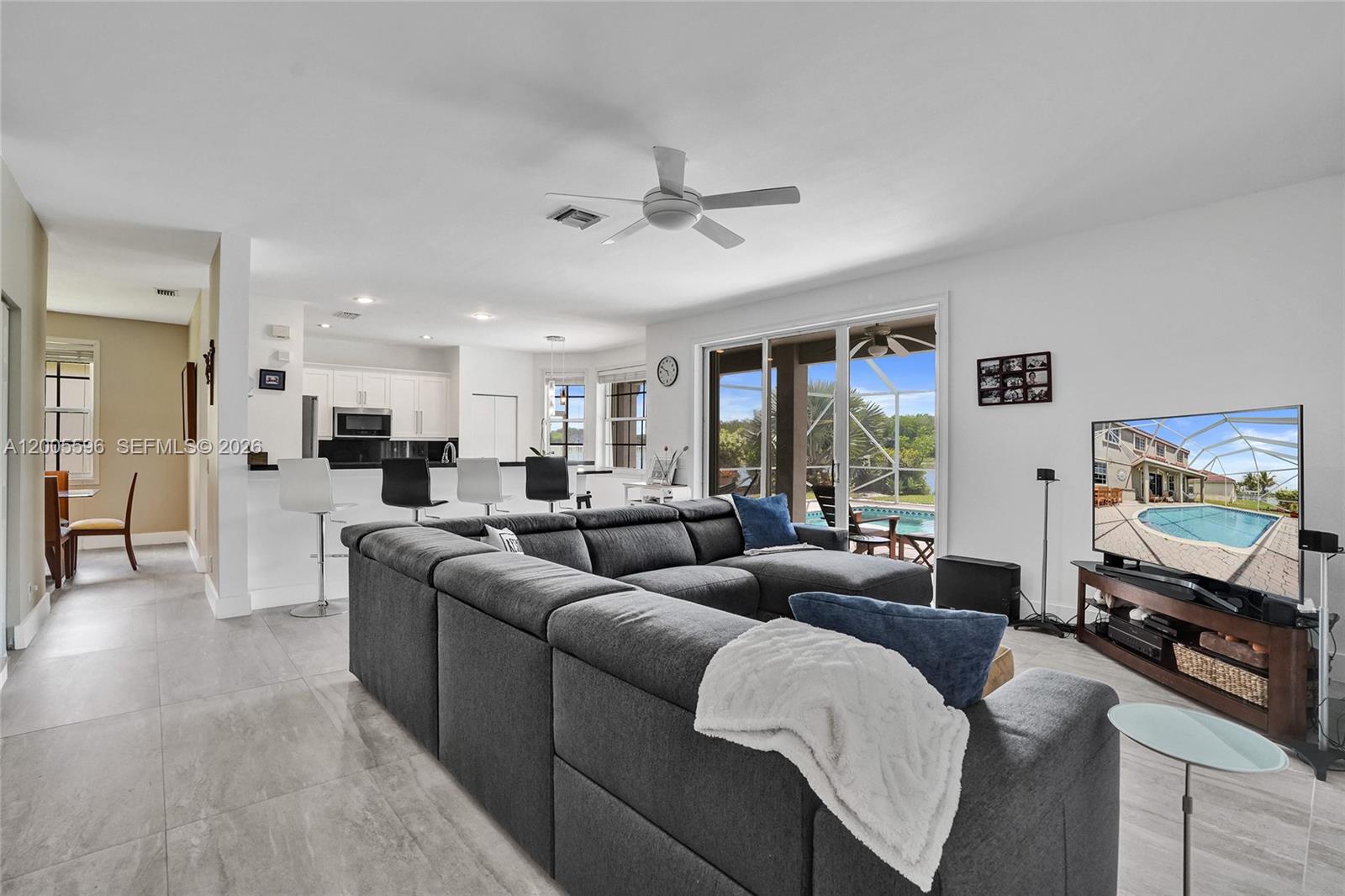 4281 Laurel Ridge Circle Weston, FL 33331 - Photo 22 of 80 a living room with furniture and a flat screen tv