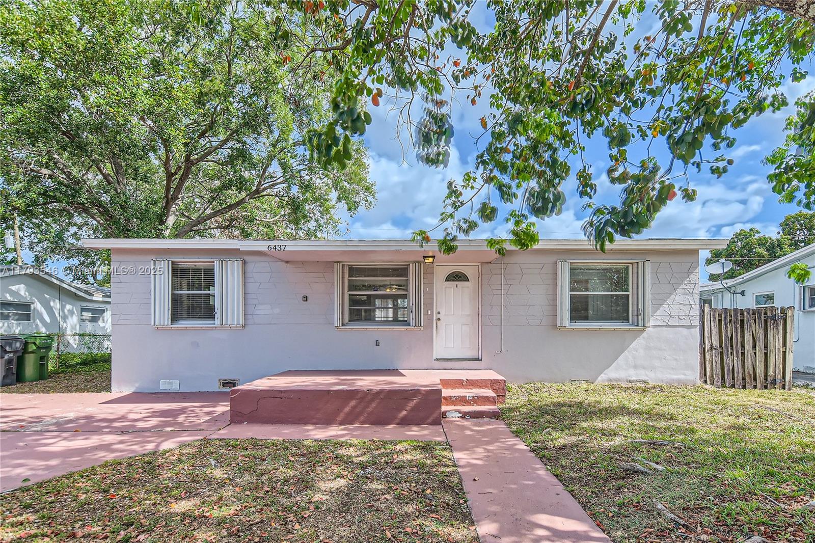 6437 Custer Street Hollywood, FL 33024 - Photo 1 of 22 front view of a house with a yard
