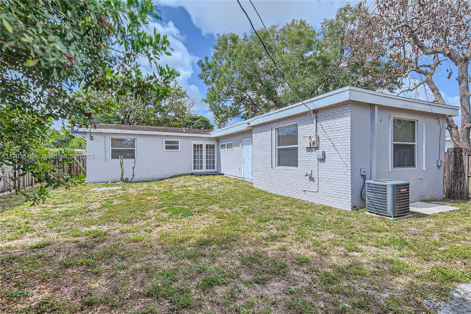 6437 Custer Street Hollywood, FL 33024 - Photo 22 of 22 a view of a house with a yard and large tree