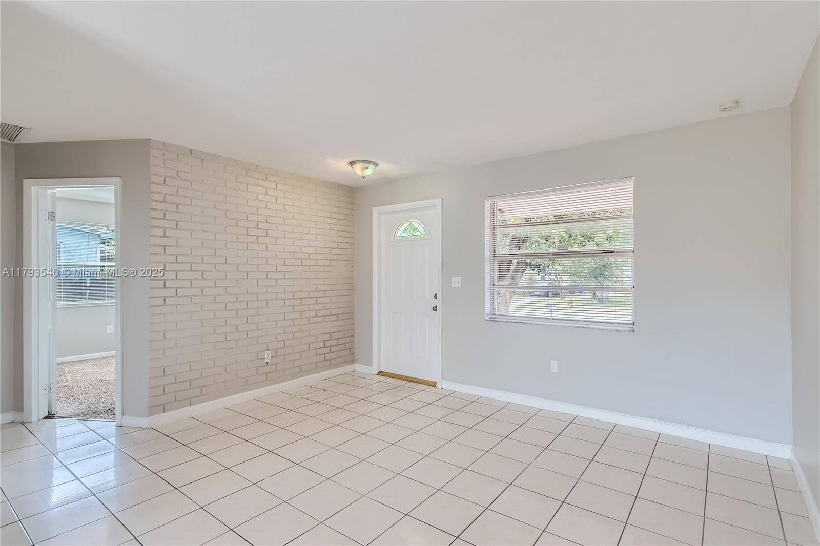 6437 Custer Street Hollywood, FL 33024 - Photo 4 of 22 an empty room with windows