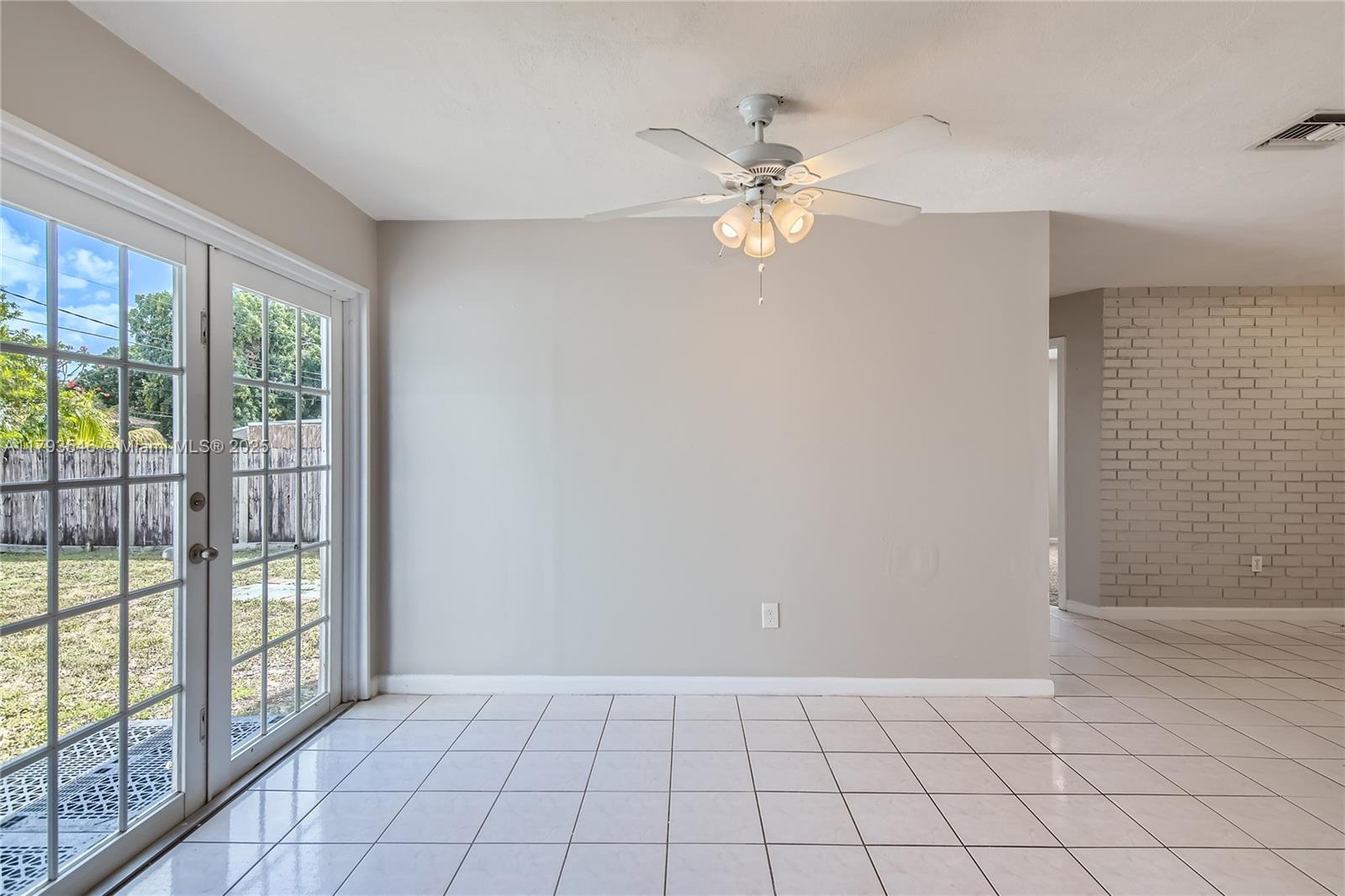 6437 Custer Street Hollywood, FL 33024 - Photo 7 of 22 a view of an empty room with window