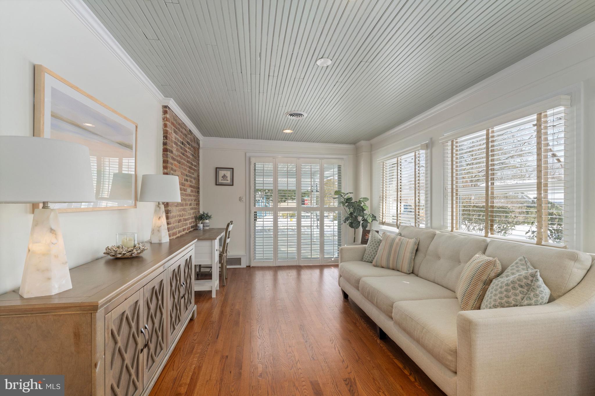 3531 South River Terrace Edgewater, MD 21037 - Photo 12 of 35 a living room with furniture wooden floor and a large window