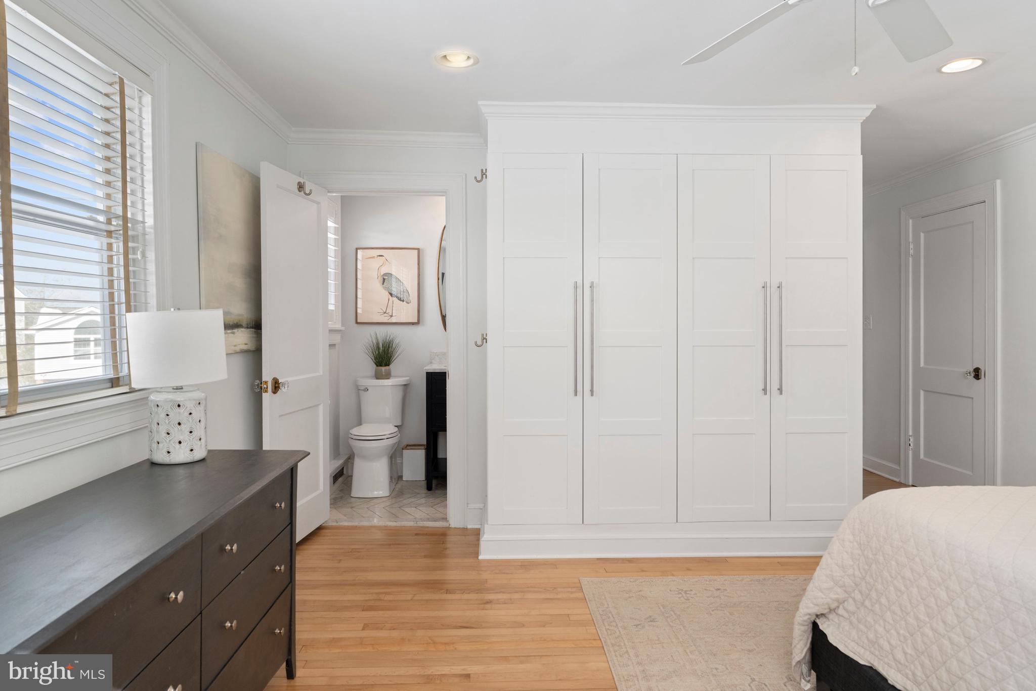 3531 South River Terrace Edgewater, MD 21037 - Photo 14 of 35 a spacious bedroom with a bed and a dresser