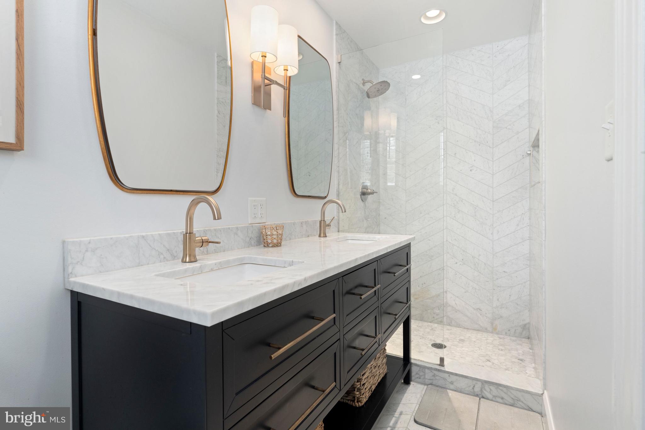 3531 South River Terrace Edgewater, MD 21037 - Photo 15 of 35 a bathroom with a sink vanity and a mirror
