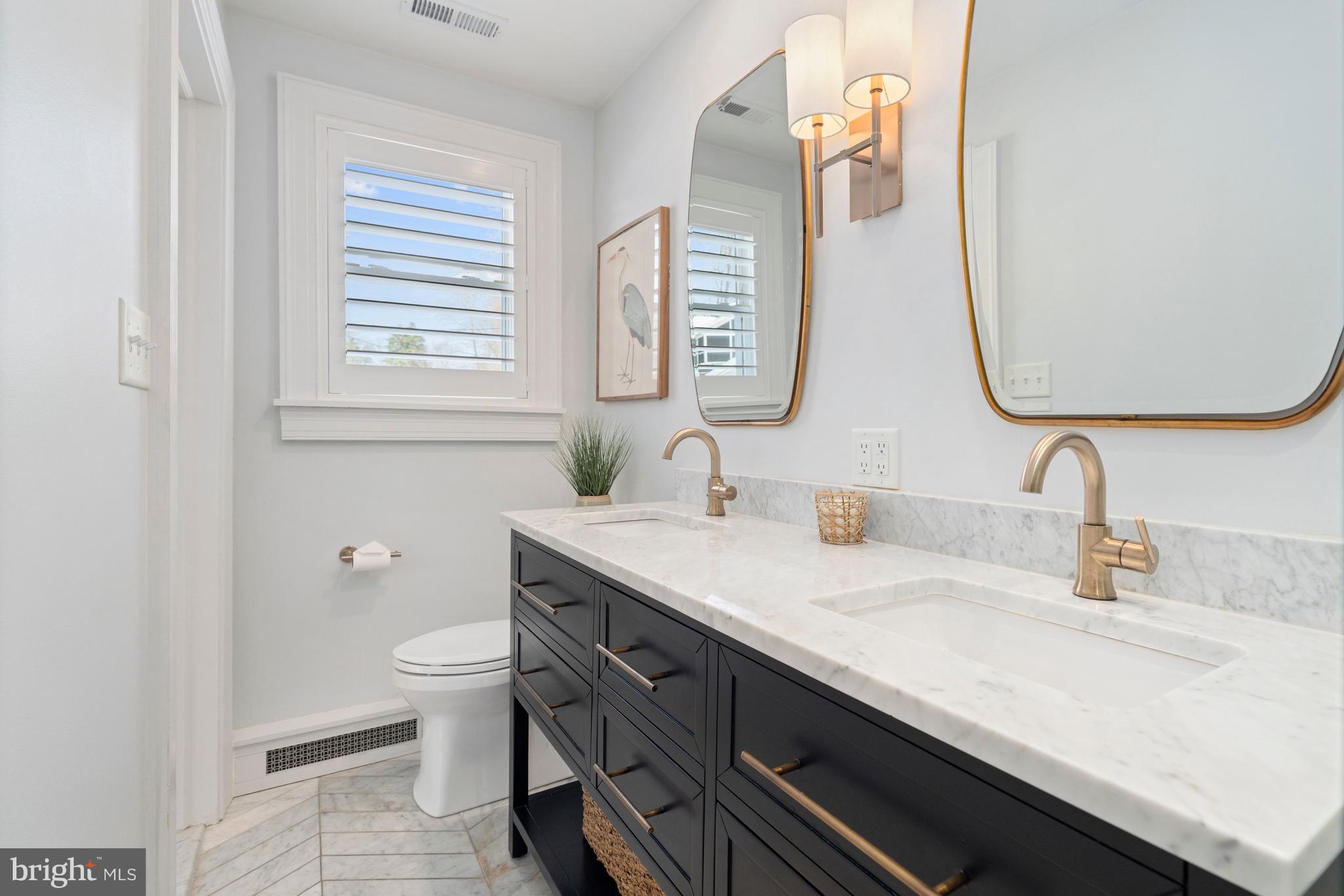 3531 South River Terrace Edgewater, MD 21037 - Photo 16 of 35 a bathroom with a granite countertop sink and a mirror