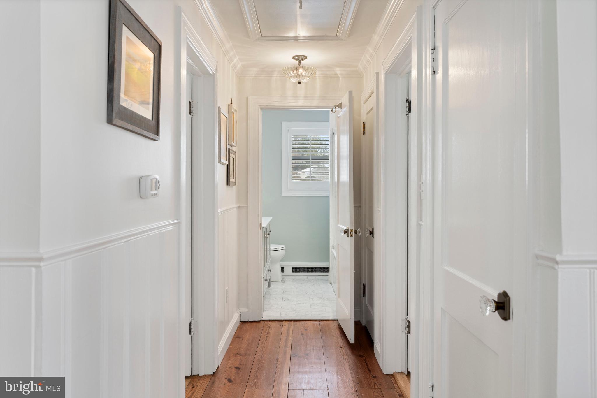 3531 South River Terrace Edgewater, MD 21037 - Photo 20 of 35 a view of a hallway with wooden floor and a bathroom