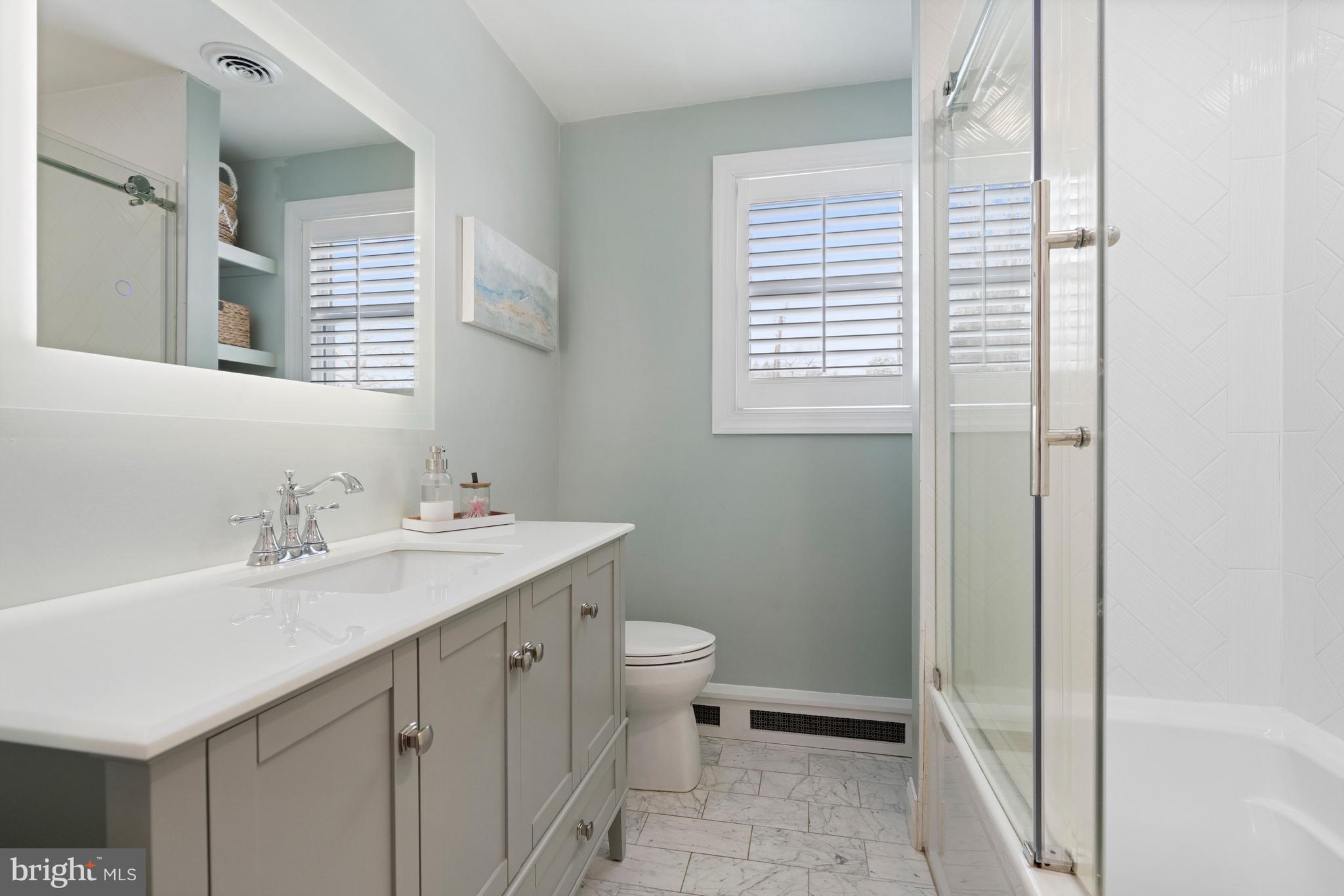 3531 South River Terrace Edgewater, MD 21037 - Photo 21 of 35 a bathroom with a sink toilet and vanity