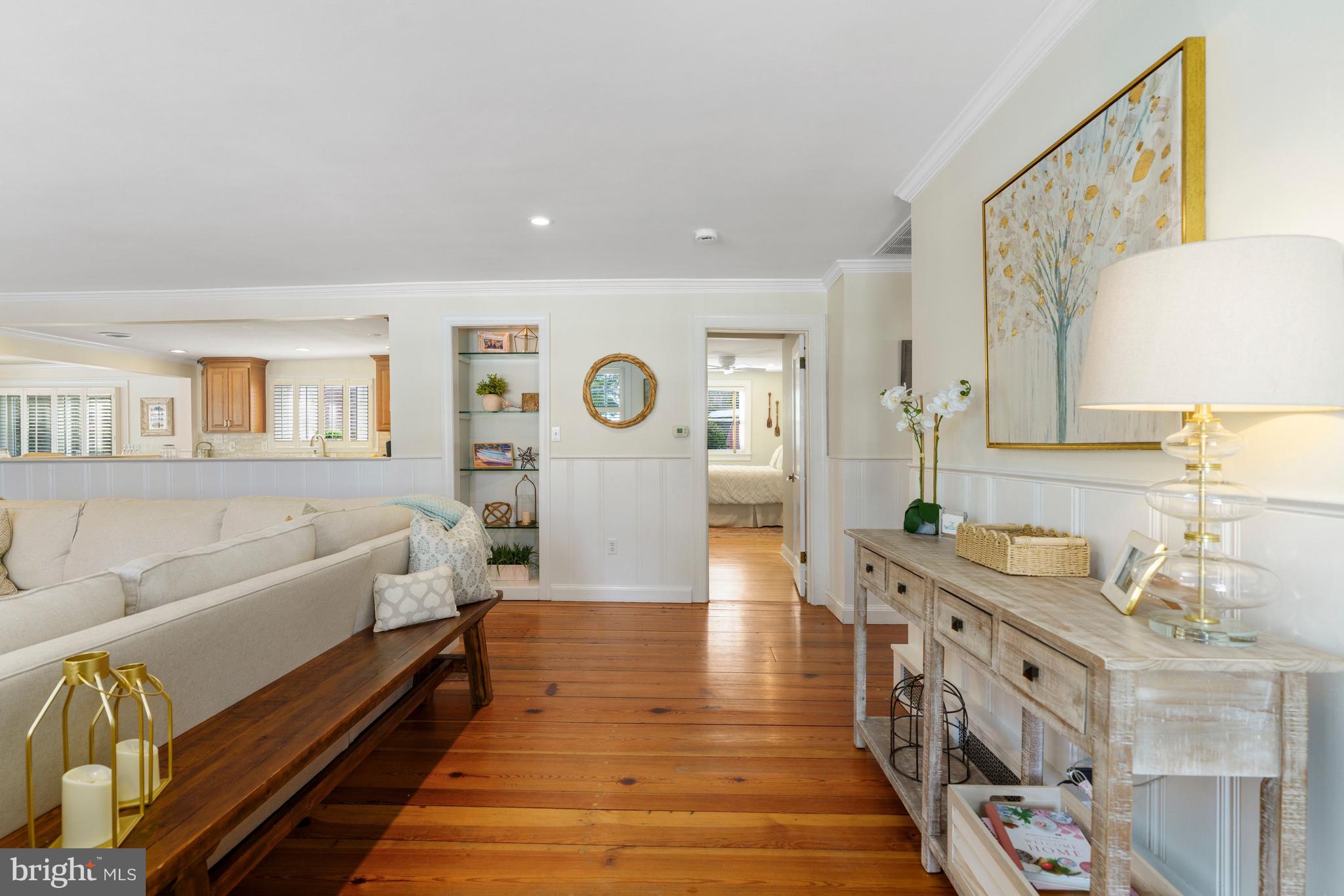 3531 South River Terrace Edgewater, MD 21037 - Photo 3 of 35 a spacious bedroom with a bed and a couch
