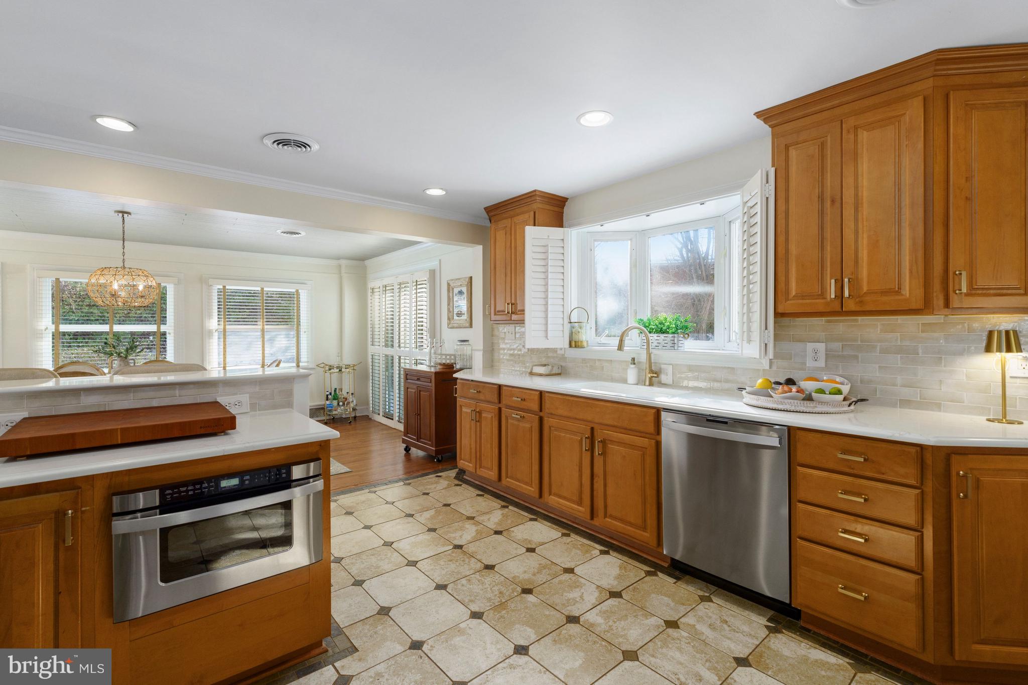 3531 South River Terrace Edgewater, MD 21037 - Photo 9 of 35 a kitchen with a stove sink and microwave