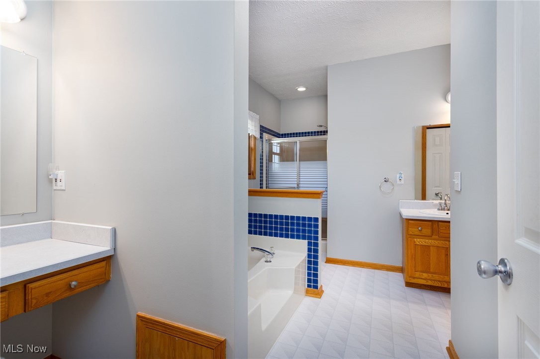 5415 Spieth Road Medina, OH 44256 - Photo 25 of 47 master bath with separate jacuzzi tub and make up vanity