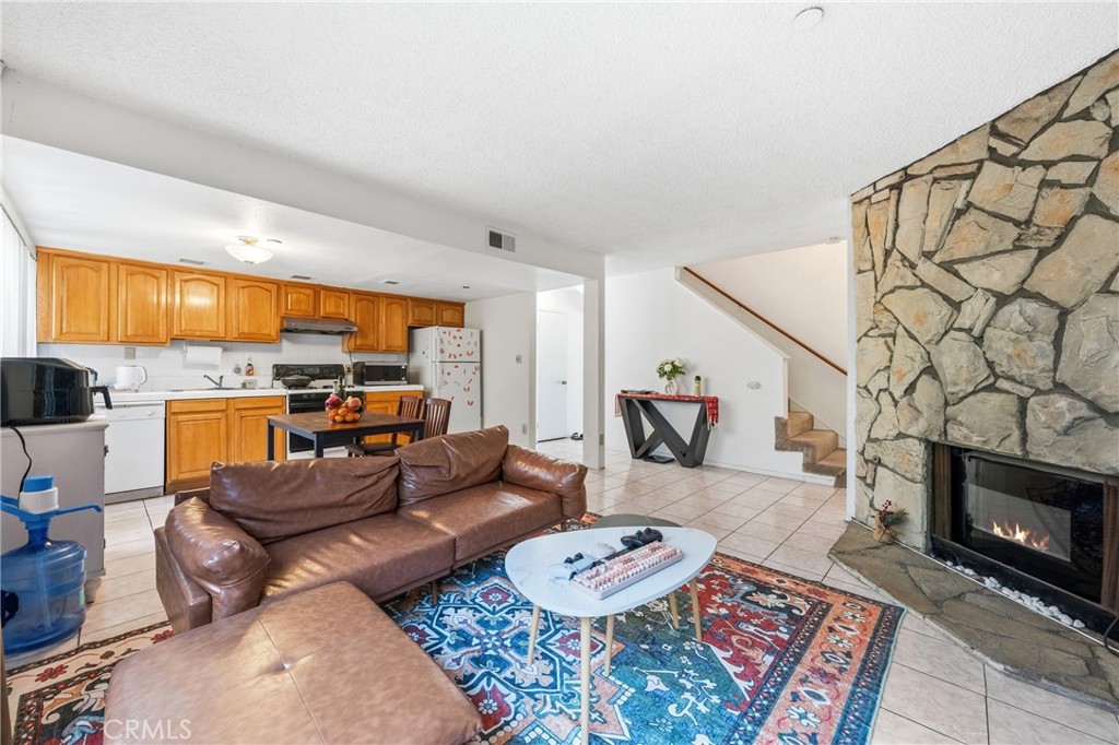 9471 Cortada Street El Monte, CA 91733 - Photo 12 of 27 a living room with furniture and a fireplace