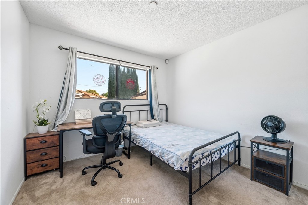 9471 Cortada Street El Monte, CA 91733 - Photo 19 of 27 a bedroom with a workspace