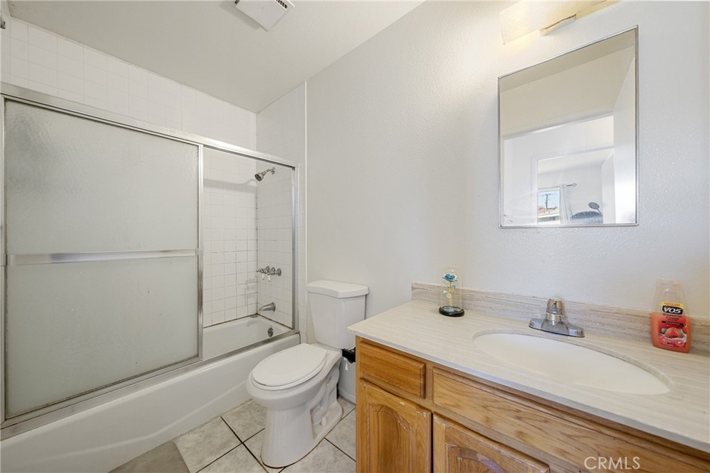 9471 Cortada Street El Monte, CA 91733 - Photo 20 of 27 a bathroom with a sink a toilet and shower